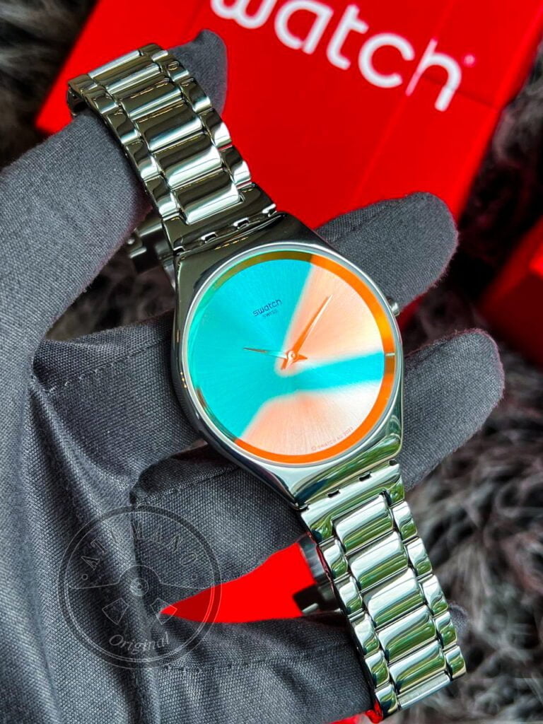 Reloj Swatch THE GLOW OF IRONY (SYXS155G)